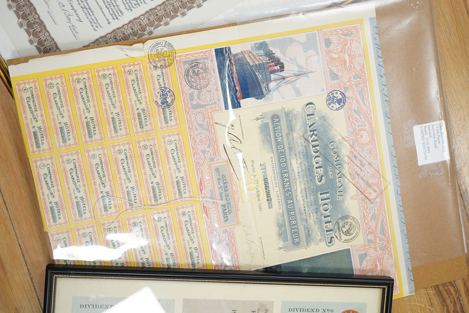Share certificates, two framed to include McIntyre Porcupine Mines Ltd